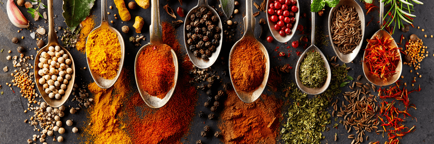 Nine different spices on spoons electronic banner